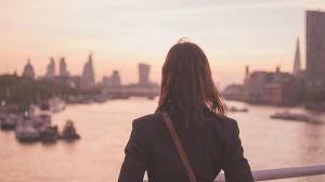 Woman looking out into the city. Why do I feel so empty and numb?